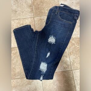 Levi slimming skinny jeans! Like new size 11.  Rips by design, very stretchy!